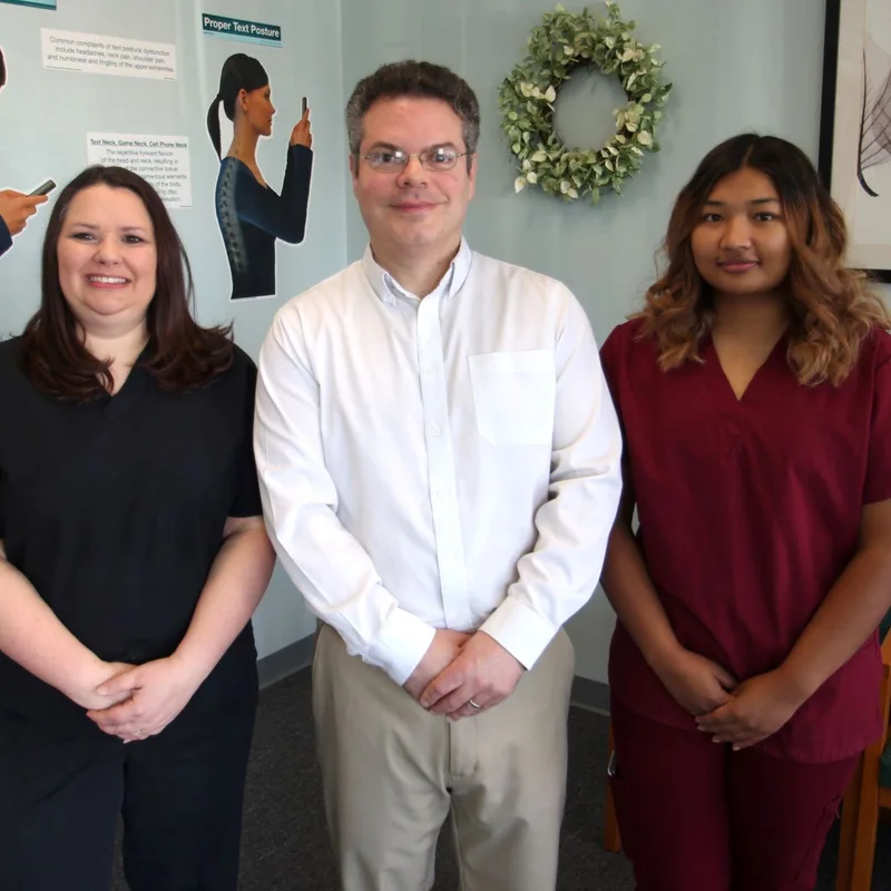 Dr. Craig Schulman and the Chiropractic Fitness team in the Charlotte clinic